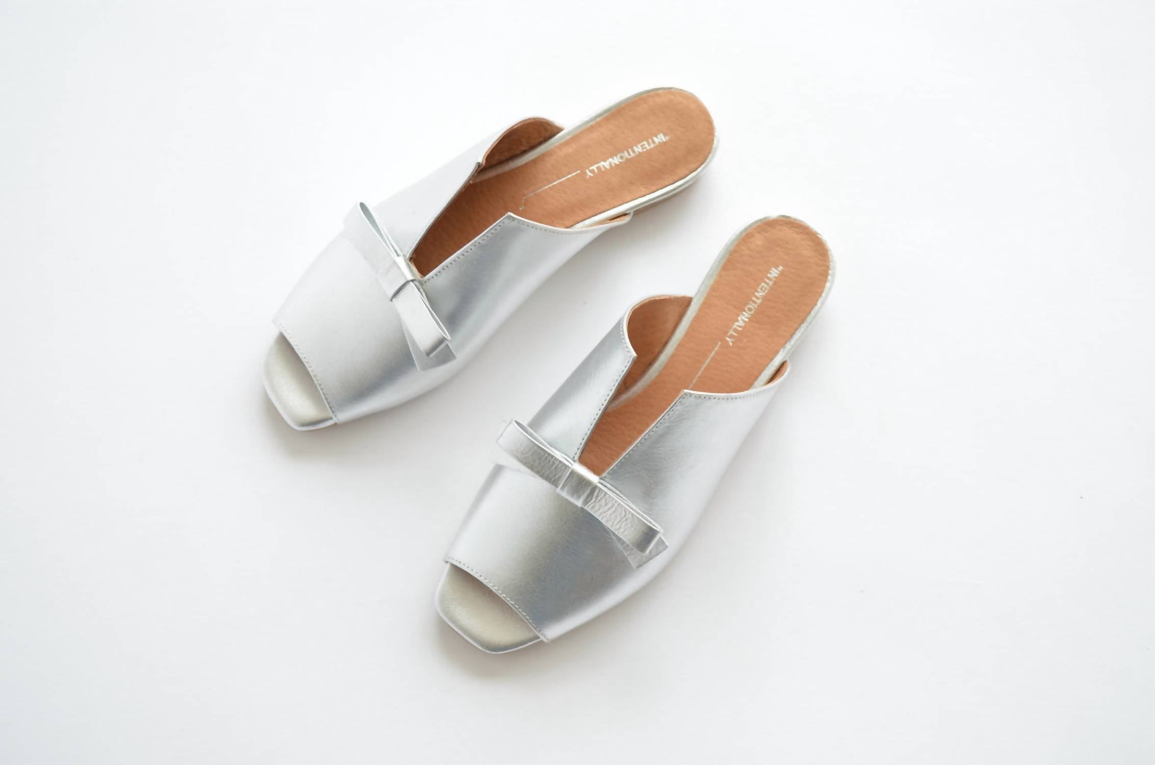 257147e0-186d-4e94-84d6-3f7a5a58381c-upscale_15k-1500x1500-70 Intentionally Blank - Women's Palace Slide Sandal - Image 1